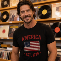 Load image into Gallery viewer, America Est. 1776 Unisex Tee – Red Text – lifestyle photo